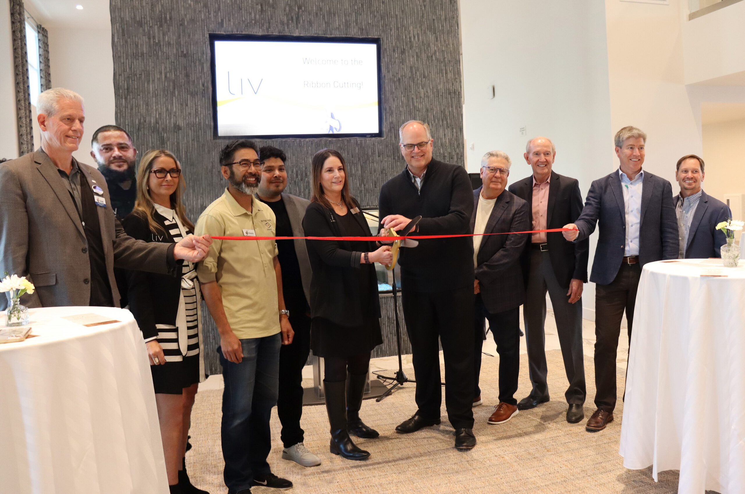 Taking part in the ribbon cutting at Liv+ Union Peak are (left to right) Chuck Finzer, Kevin Robleto, Heidi Arave-Noonan, Scott Yath, Abner Diaz, Katie Chambers, Don Hoekstra, William Fettis, Eric Johnston, Kevin Lindquist, and Scott Brooks.